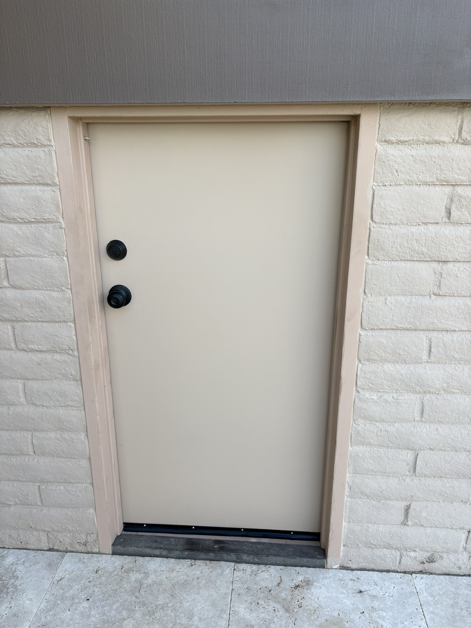 Painted maintence door installed with black hardware